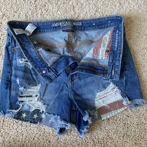 Size 12 American Eagle jean shorts. Ripped and have red white and blue pockets.